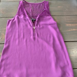 Super cute top with front zipper and lace back